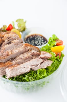 Grilled pork and teriyaki sauce (Japanese sweet sauce) cooked by clean food concept with salad in lunch box