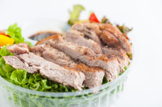 Grilled pork and teriyaki sauce (Japanese sweet sauce) cooked by clean food concept with salad in lunch box