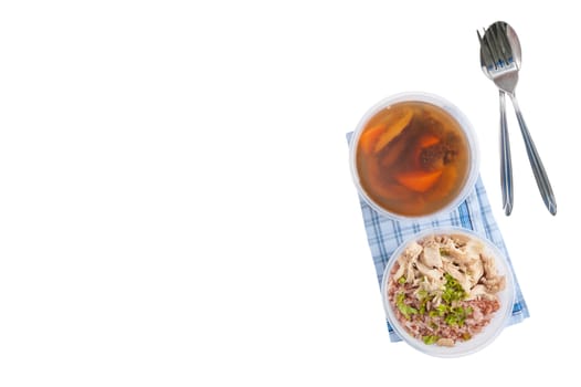 Brown rice gruel with chicken breast with vegetables soup cooked by clean food concept in separate lunch box isolated on white background
