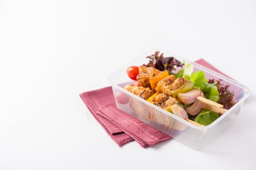Chicken breast barbecue cooked by clean food concept and vegetables in lunch box on white table