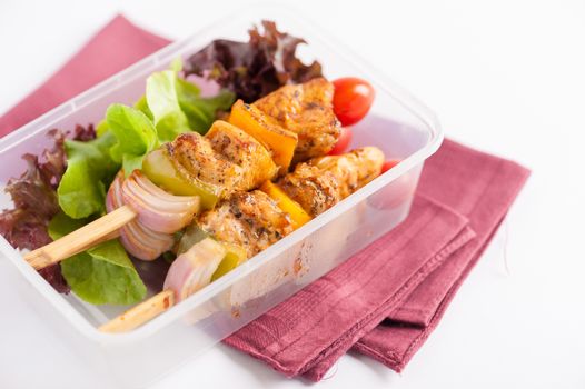 Chicken breast barbecue cooked by clean food concept and vegetables in lunch box on white table