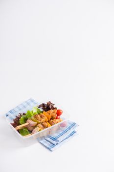 Chicken breast barbecue cooked by clean food concept and vegetables in lunch box on white table