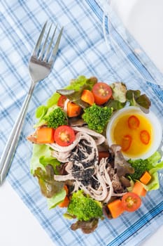 Chicken breast salad with honey thyme sauce cooked by clean food concept in lunch box on white table