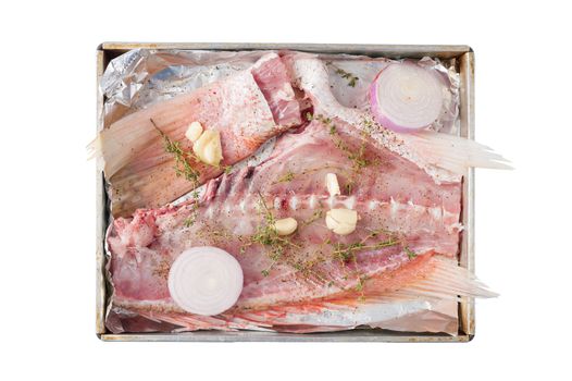 Ingredients for making fish stock soup in steel tray isolated on white background
