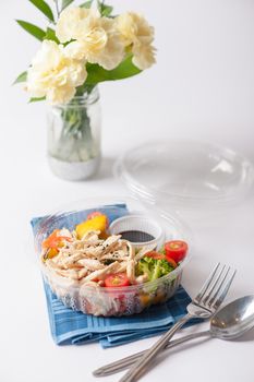 Salad soba with vegetables and shred chicken cooked by clean food concept in lunch box on white table