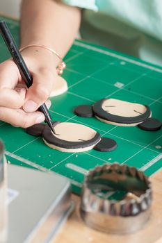 The process of making fondant cake, fondant sugar mod action, writing on fondant sugar with food edible marker