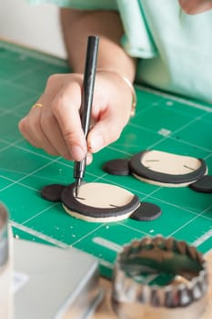 The process of making fondant cake, fondant sugar mod action, writing on fondant sugar with food edible marker