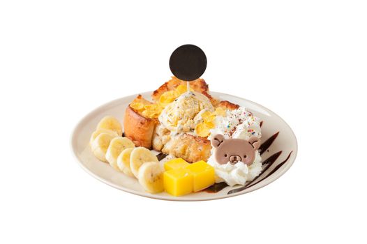 Honey toast with banana, whipped cream, chocolate chip ice cream, and mango jelly on white dish with black circle tag stab down on the ice cream isolated on white background with clipping path