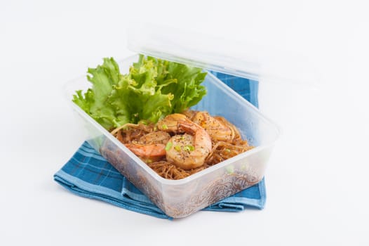 Shrimp and vermicelli baked with herbs (Goong Ob Woonsen) and cooked by clean food concept in lunch box set on white table