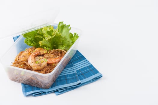 Shrimp and vermicelli baked with herbs (Goong Ob Woonsen) and cooked by clean food concept in lunch box set on white table