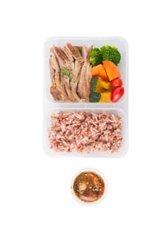Roasted pork tenderloin with vegetables cooked by clean food concept with brown rice and Northern Thai local sauce isolated on white background with clipping path