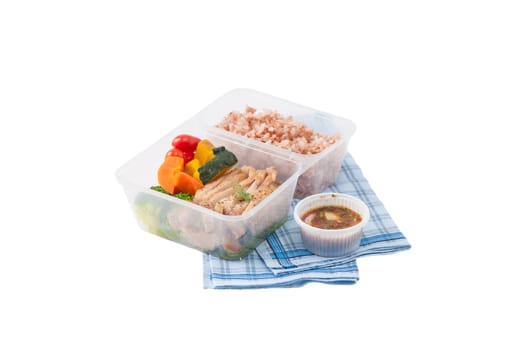 Roasted pork tenderloin with vegetables cooked by clean food concept with brown rice and Northern Thai local sauce isolated on white background with clipping path
