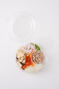 Thai spicy salad with minced pork, mushroom, vegetables and vermicelli cooked by clean food concept on white table