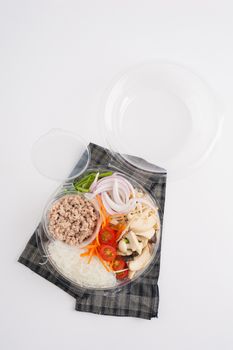 Thai spicy salad with minced pork, mushroom, vegetables and vermicelli cooked by clean food concept on white table