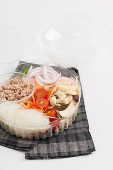Thai spicy salad with minced pork, mushroom, vegetables and vermicelli cooked by clean food concept on white table