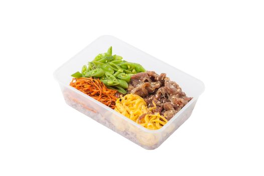 Bibimbub in clean food style. Brown rice with roasted pork, egg, and vegetables isolated on white background with clipping path