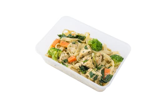 Fettuccine pesto sauce with spinach, grilled fish and vegetables cooked by clean food concept in lunch box isolated on white background with clipping path