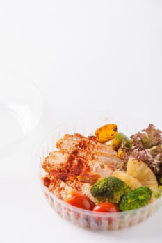 Roasted chicken with paprika powder cooked by clean food concept and salad in lunch box on white table