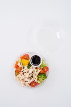Salad soba with vegetables and shred chicken cooked by clean food concept in lunch box on white table