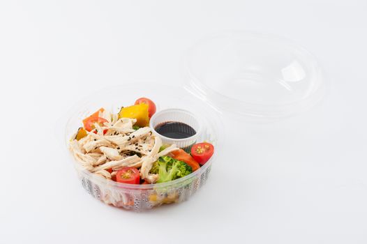 Salad soba with vegetables and shred chicken cooked by clean food concept in lunch box on white table