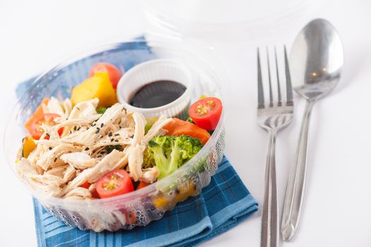 Salad soba with vegetables and shred chicken cooked by clean food concept in lunch box on white table