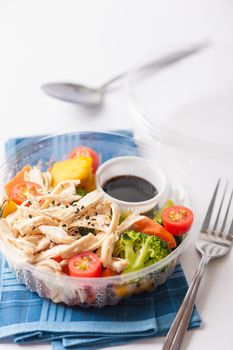 Salad soba with vegetables and shred chicken cooked by clean food concept in lunch box on white table