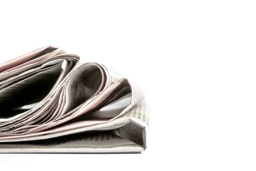 stack of financial newspapers with space for text on white background
