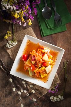 Thai mix fruit spicy dressed salad with low key scene