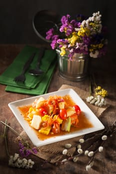 Thai mix fruit spicy dressed salad with low key scene