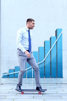 business, development, statistics and people and concept - young smiling businessman riding on skateboard outdoors over growth chart