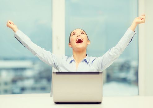 business, technology and office concept - screaming businesswoman with laptop in office