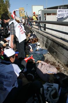 TURKEY, Ankara : Wounded people lying down in the street after a terror attack killed at least 30 people in Ankara, capital city of Turkey on October 10th, 2015. Twin explosions outside Ankara's main train station on the morning appear to have targeted hundreds of people who had gathered to protest violence between authorities and Kurdish separatist group, the PKK.