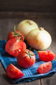 Vegetables on wood table with low key scene