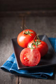 Vegetables on wood table with low key scene