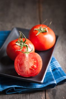 Vegetables on wood table with low key scene