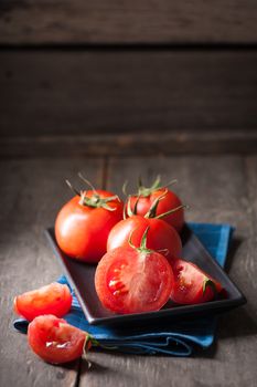 Vegetables on wood table with low key scene