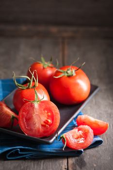 Vegetables on wood table with low key scene