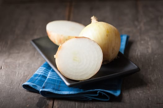 Vegetables on wood table with low key scene