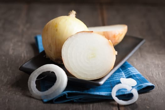 Vegetables on wood table with low key scene