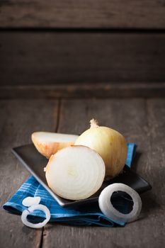 Vegetables on wood table with low key scene
