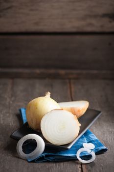 Vegetables on wood table with low key scene