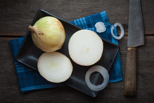 Vegetables on wood table with low key scene