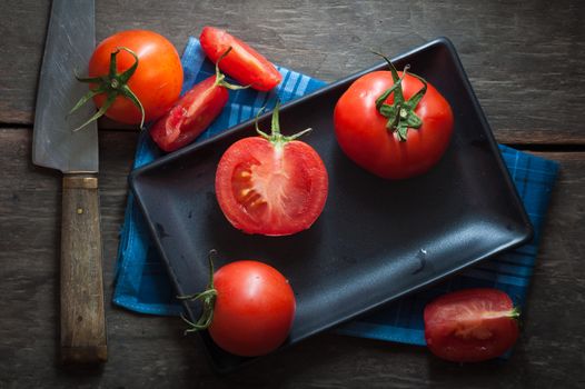 Vegetables on wood table with low key scene