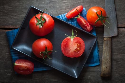 Vegetables on wood table with low key scene
