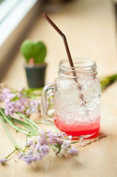 Italian soda on wood bar in cafe
