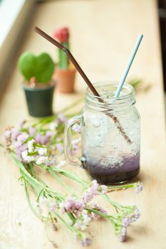 Italian soda on wood bar in cafe