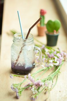 Italian soda on wood bar in cafe