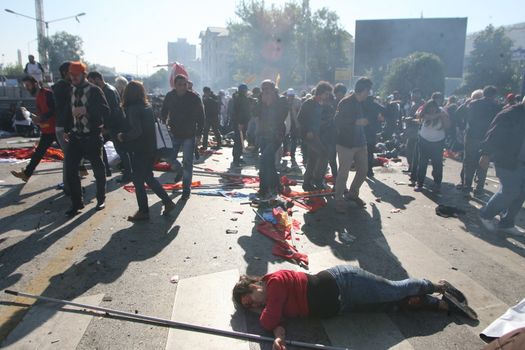 TURKEY, Ankara : People run from the twin explosions site which killed at least 30 people in Ankara, capital city of Turkey on October 10th, 2015.  Twin explosions outside Ankara's main train station on the morning appear to have targeted hundreds of people who had gathered to protest violence between authorities and Kurdish separatist group, the PKK.