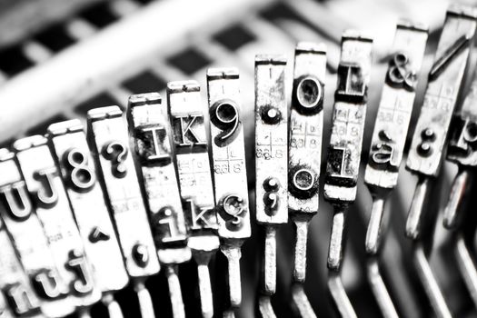 detail of type bars of typewriter with some type bars unfocused