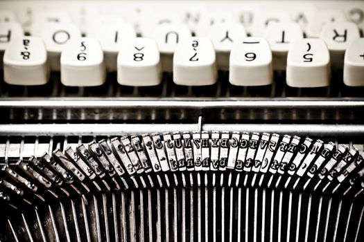 detail of type bars and white buttons of typewriter